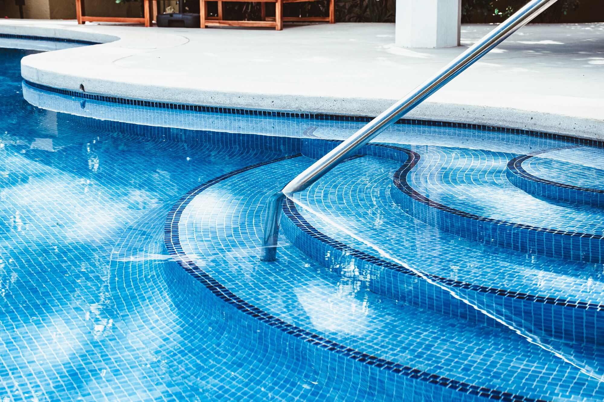 Serena pool mosaic steps and handrail