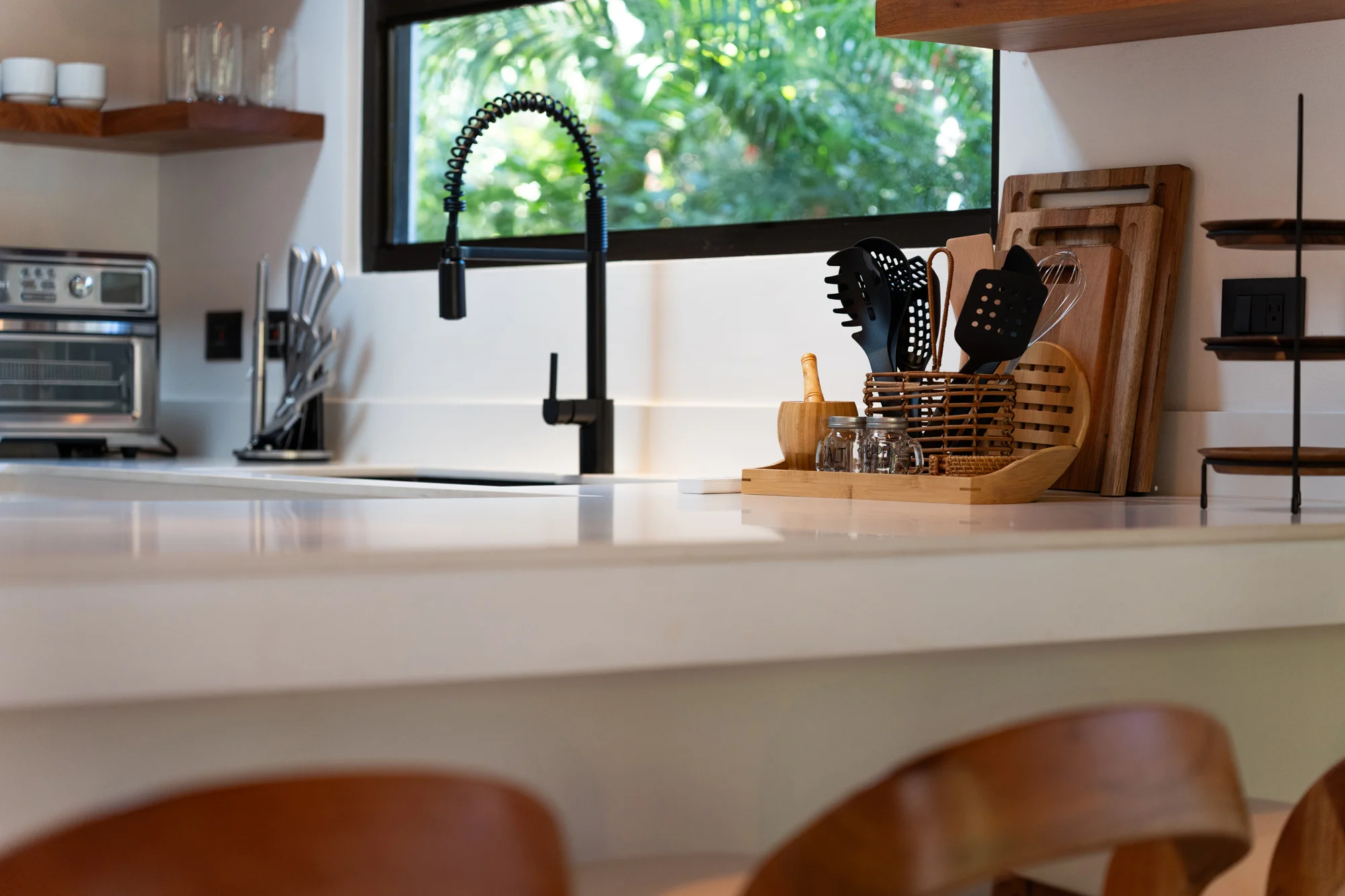 Serena villa kitchen counter with faucet and utensils