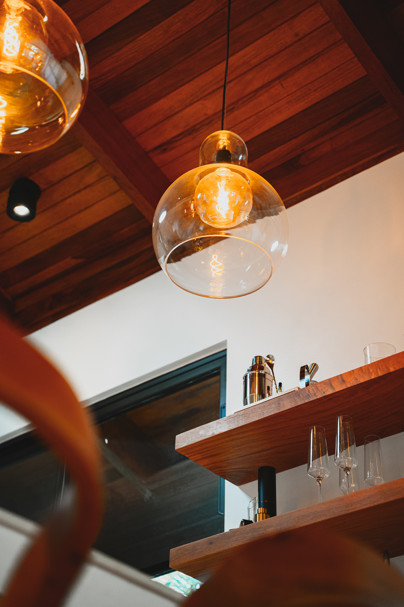 Pendant light and ceiling above bar
